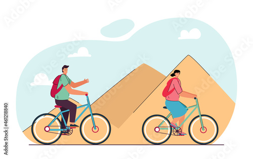 Cartoon tourist couple riding bicycles through desert. Man and woman in front of pyramids in Egypt flat vector illustration. Traveling, tourism, transportation concept for banner or landing web page © PCH.Vector