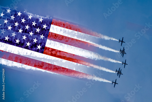USA air forces strike concept. Fighter aircrafts with American flag contrail