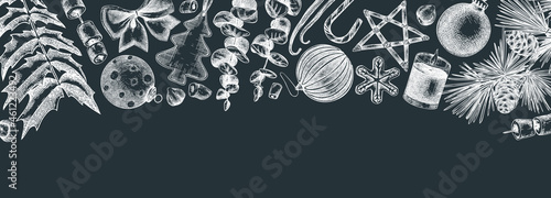 Vintage Christmas banner design on chalkboard. Hand-sketched holiday background with Christmas decoration, traditional sweets and winter plants for banners, web, ads, packaging.