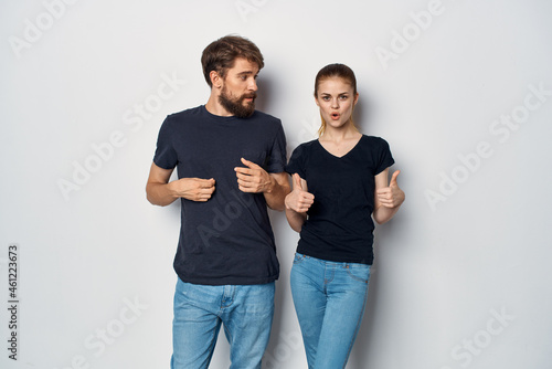 married couple in black t-shirt sunglasses posing studio lifestyle