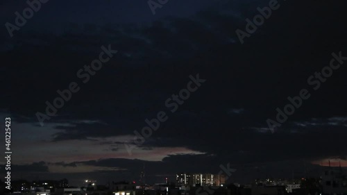 time lapse of clouds over city