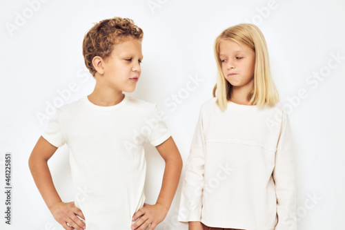 Image of boy and girl little cheerful cheery friends light background