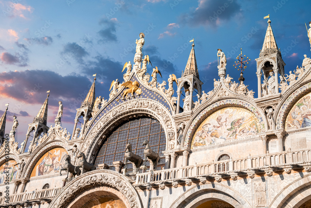 Beautiful details of Basilica di San Marco in Venice. Architectural design in Venice, horses, golden statues and towers of the Basilica di San Marco.