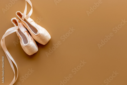 Used ballet pointe shoes or slippers with ribbon, top view