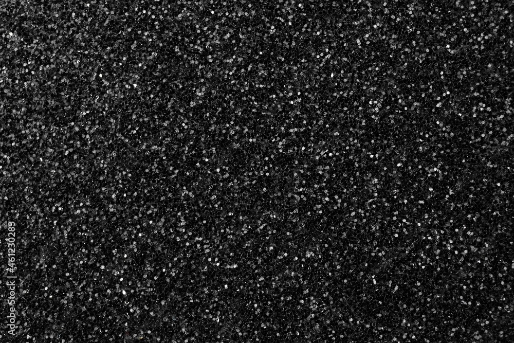 Black glitter texture background, glitter or sandpapper high detailed surface, shining glowing effects concept Black glitter texture background, glitter or sandpapper high detailed surface, shining glowing effects concept