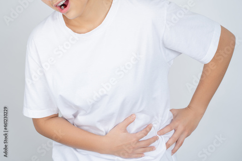 Woman has stomachache isolated over white background.