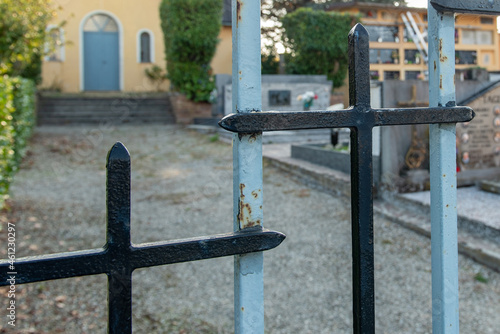 6 October 2021. Quattro Castella. Italy. Iron gate with crosses of a cemetery.