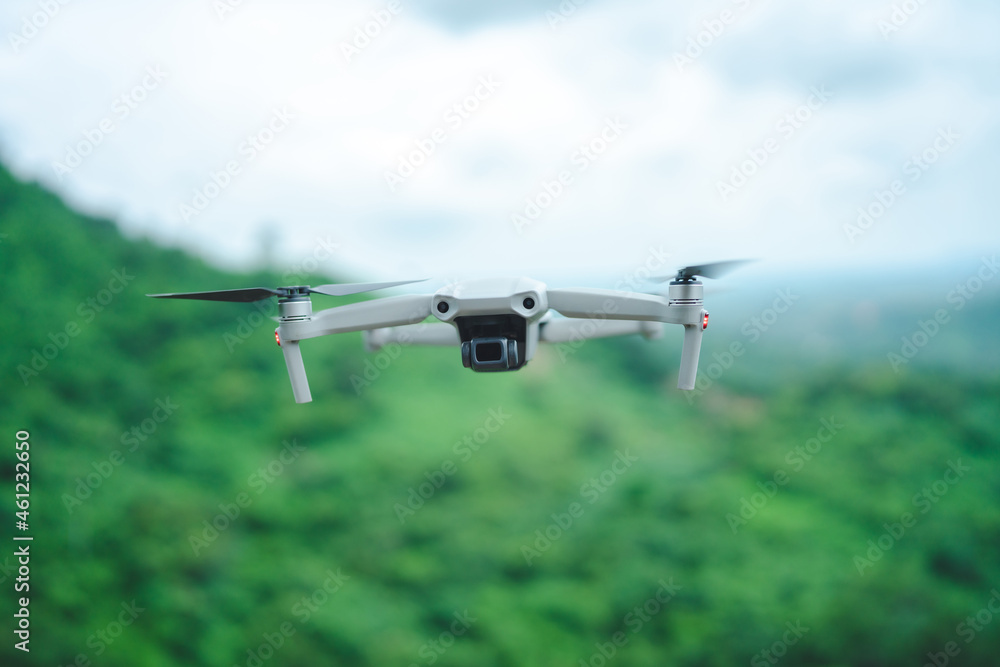 Naklejka premium hight technology of helicopter drone for take a photo in aerial top view, flying on sky by remote control, professional aircraft robot innovation
