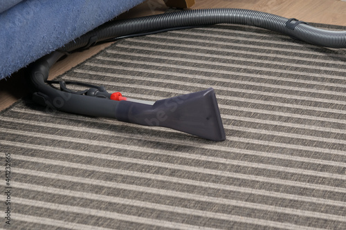 equipment for cleaning and washing carpets lies on the floor photo