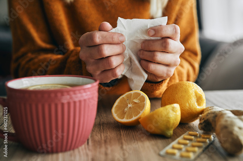 Fotografie Unrecognizable ill woman with tissue and immune ingredients