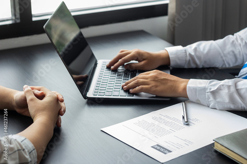 Managers print information from applicants' resumes coming in for an interview for an accounting position at a company, HR managers reviewing applicants' resumes, job interview ideas and recruiting.