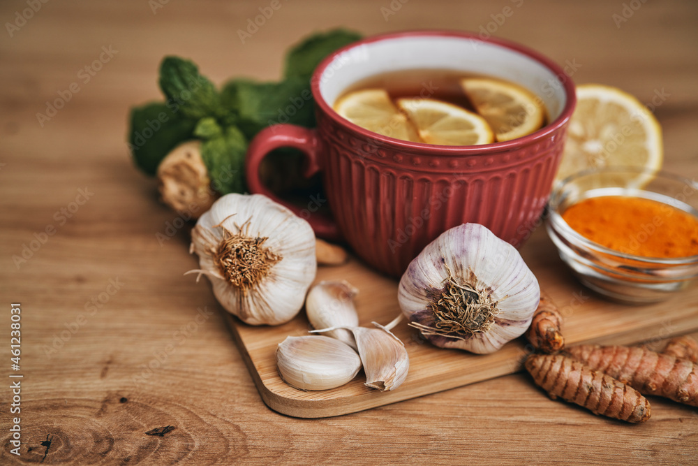 Winter tea and natural antioxidants on wooden desk