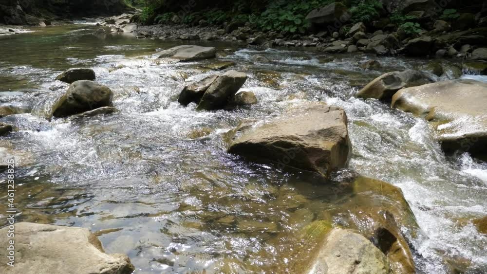 Fresh transparent waters bypassing big rocks the Carpathians in summer Fresh transparent waters bypassing big rocks the Carpathians in summer