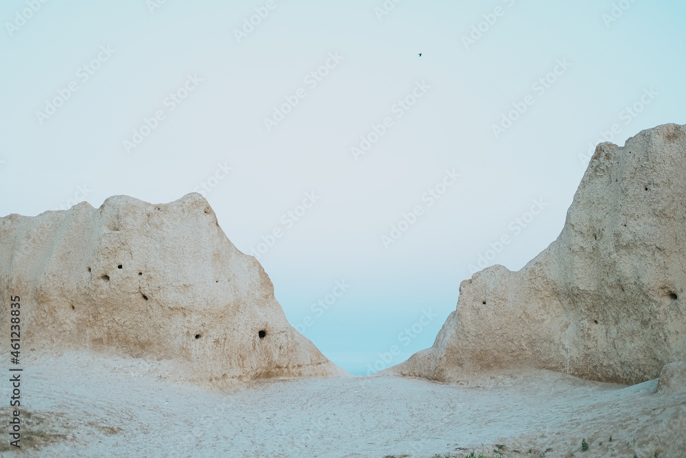 mountains above the sea near the water fog