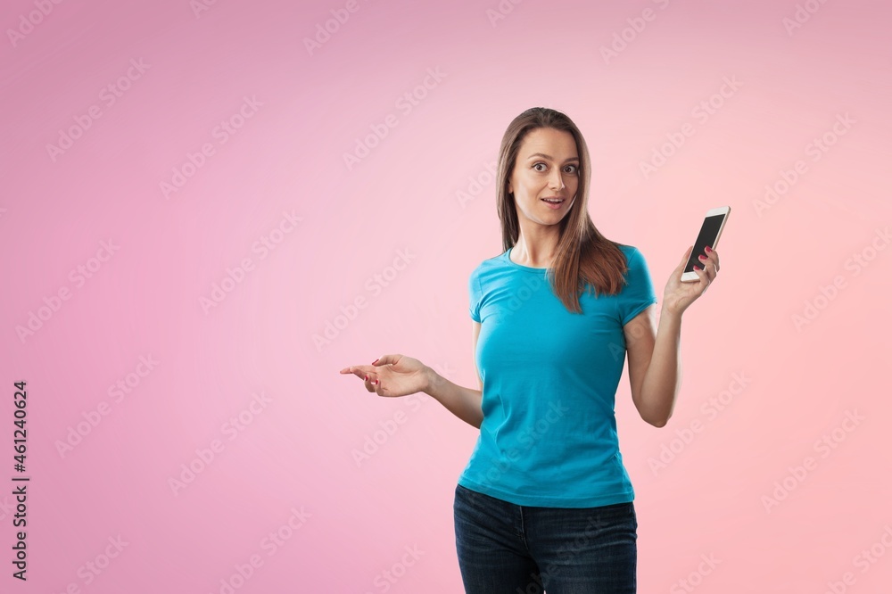 Joyful lady pointing at blank space, in excitement over background. Joyful lady pointing at blank space, in excitement over background.