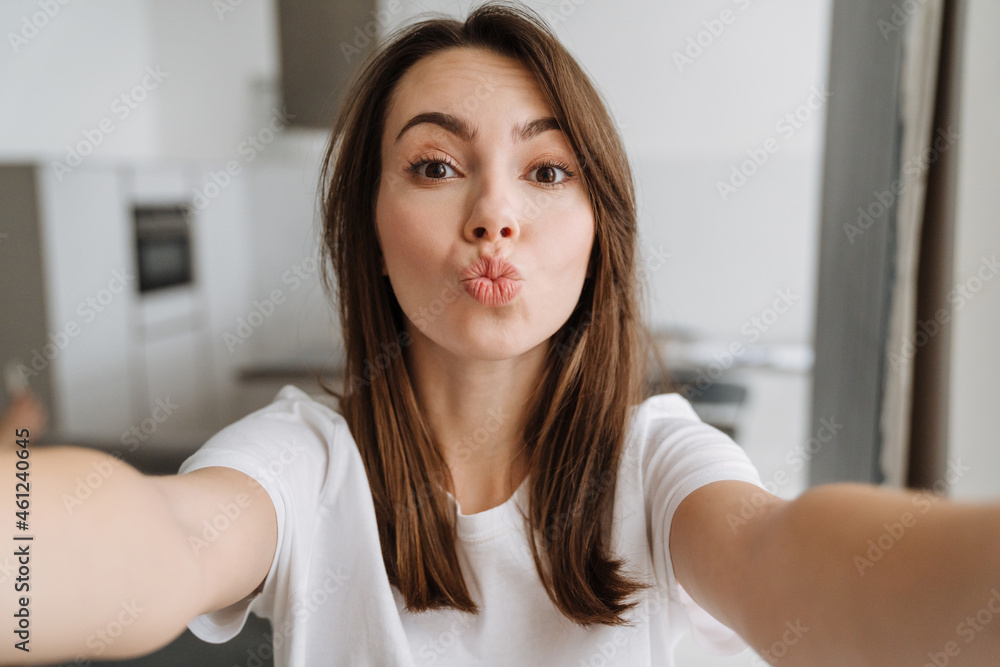 Smiling young woman in lounge wear standing Smiling young woman in lounge wear standing
