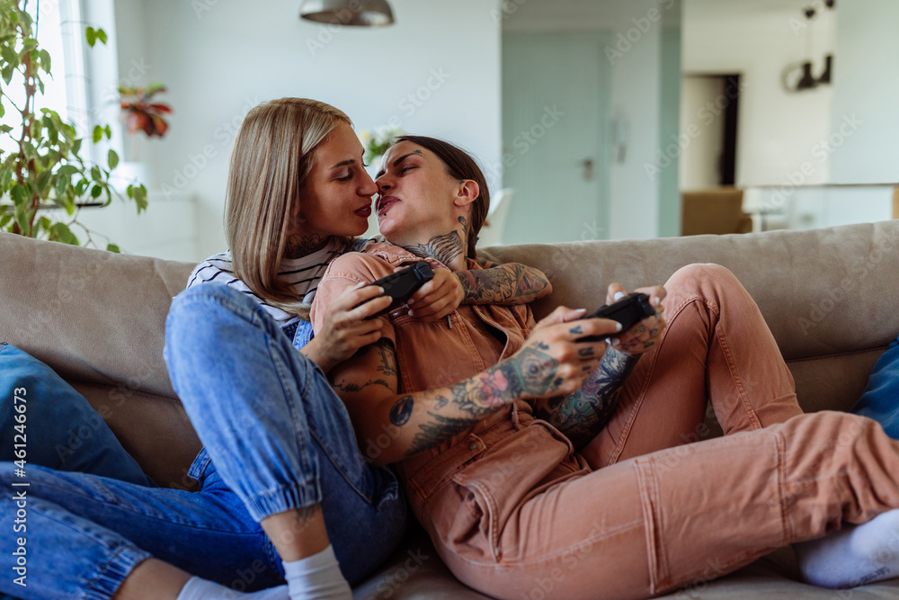 Lesbians Kissing On Couch