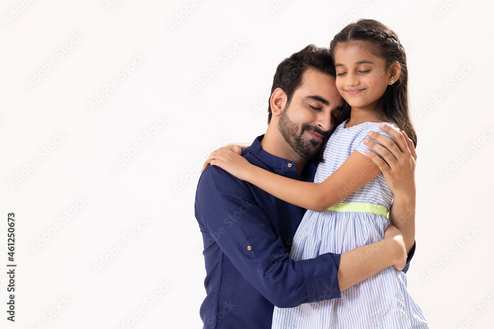 Naklejka premium A HAPPY FATHER AND DAUGHTER LOVINGLY EMBRACING EACH OTHER