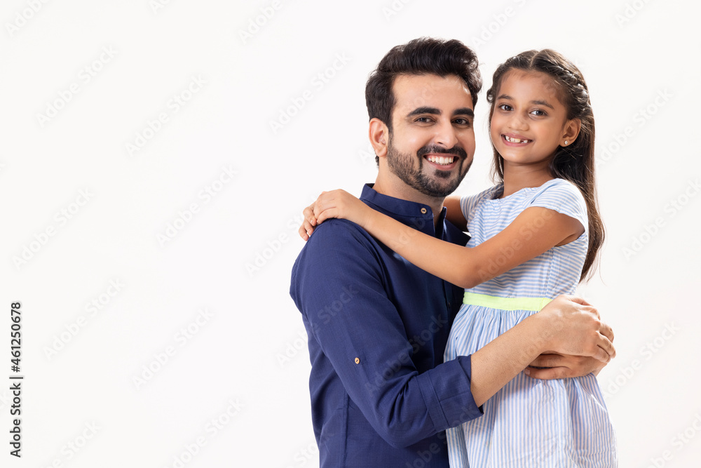 PORTRAIT OF A HAPPY FATHER AND DAUGHTER LOOKING AT CAMERA PORTRAIT OF A HAPPY FATHER AND DAUGHTER LOOKING AT CAMERA