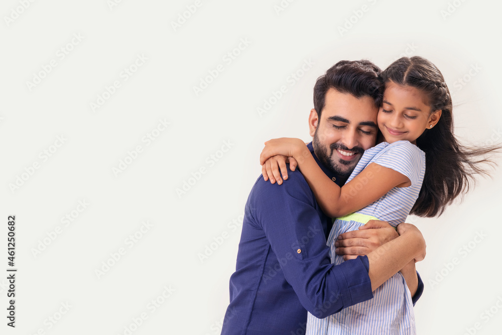 A DAUGHTER AND FATHER HAPPILY EMBRACING EACH OTHER A DAUGHTER AND FATHER HAPPILY EMBRACING EACH OTHER