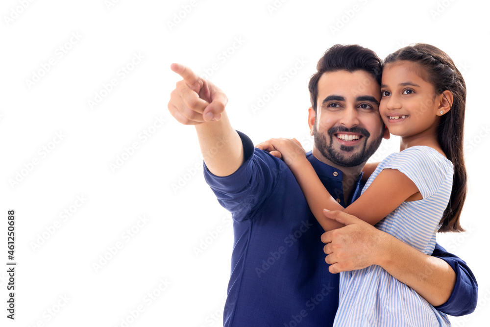 A FATHER HAPPILY POINTING AWAY TO SHOW DAUGHTER A FATHER HAPPILY POINTING AWAY TO SHOW DAUGHTER