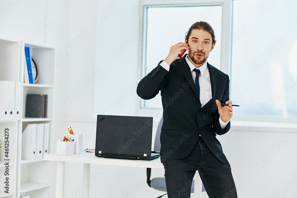 businessman holding a phone telephone office lifestyle businessman holding a phone telephone office lifestyle