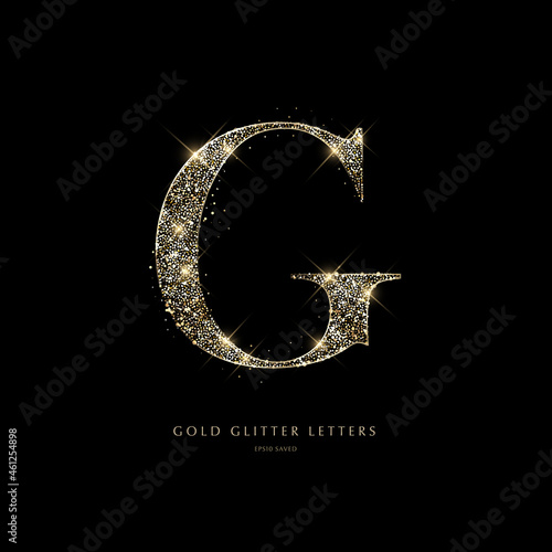 Glittering golden letters on a black background, shiny letters photo