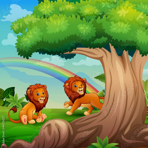 Cartoon two lions playing under the big tree