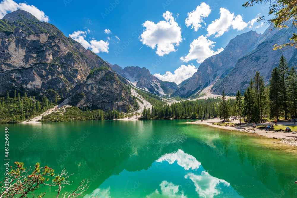 Small beautiful lake in Italian Alps. Pragser Wildsee or Lago di Braies and mountain range of Croda del Becco or Seekofel and Sasso del Signore. Dolomites, Trentino-Alto Adige, Italy, Europe.