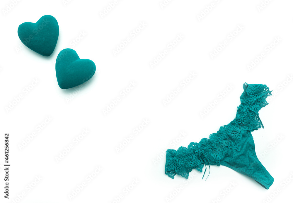 Panties and bra under the lace of a turquoise color set of female lower intimate romantic underwear on a white background Panties and bra under the lace of a turquoise color set of female lower intimate romantic underwear on a white background