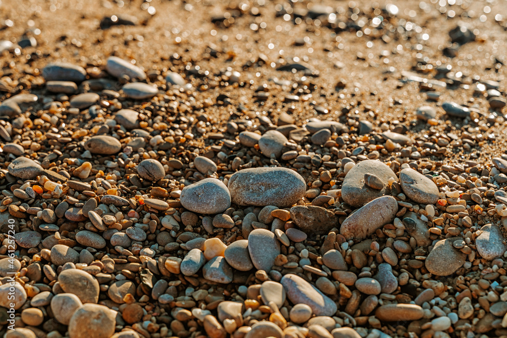 Beautiful pebbles on the beach during sunset Beautiful pebbles on the beach during sunset