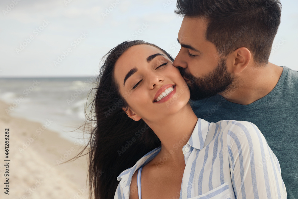 Lovely couple spending time together on beach Lovely couple spending time together on beach