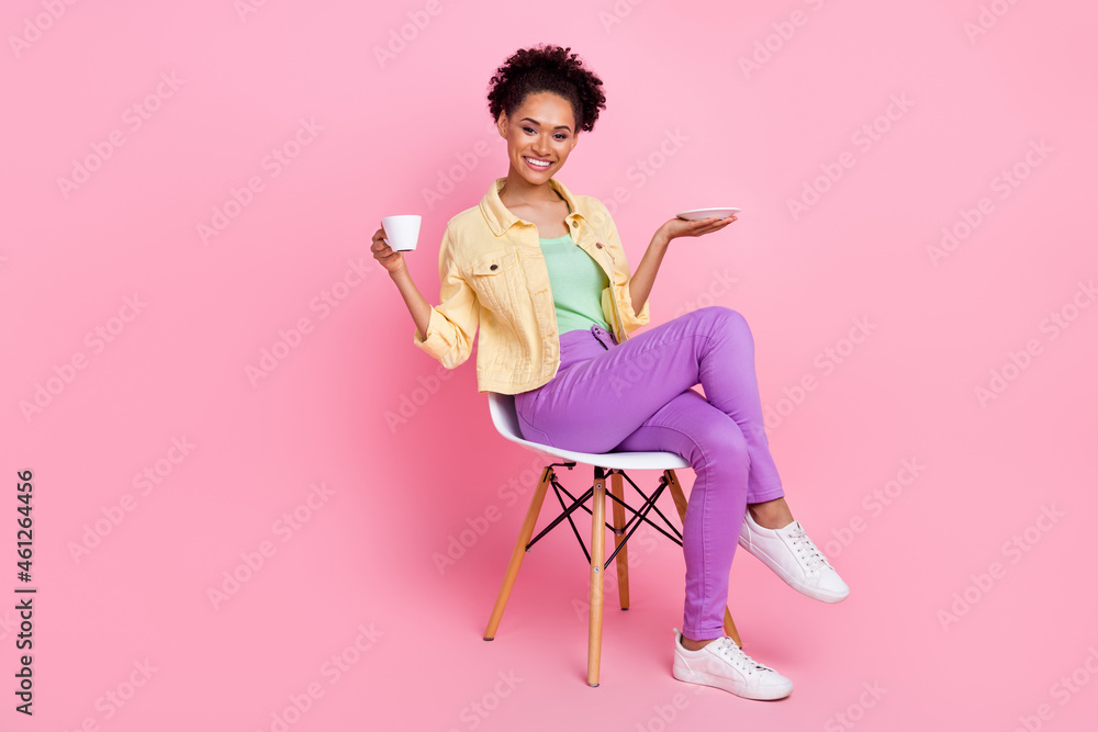 Full length photo of funny young brunette lady drink tea wear shirt trousers shoes isolated on pink background Full length photo of funny young brunette lady drink tea wear shirt trousers shoes isolated on pink background