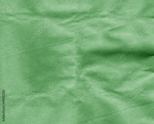 Crafted crumpled paper for background and desing in green tone.