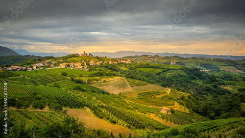Panoramic summer view of a rural village with vineyards in the alps near Dobrovo, Slovenia