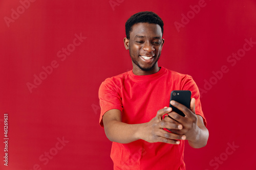 Cheerful man with phone in hands cropped view studio technology communication