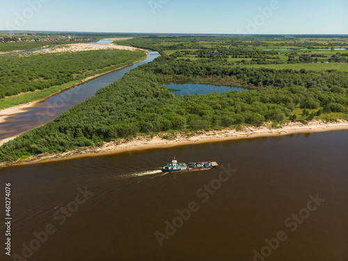 July, 2021 - Kholmogory. The river ferry transports cars. Russia, Arkhangelsk region  photo