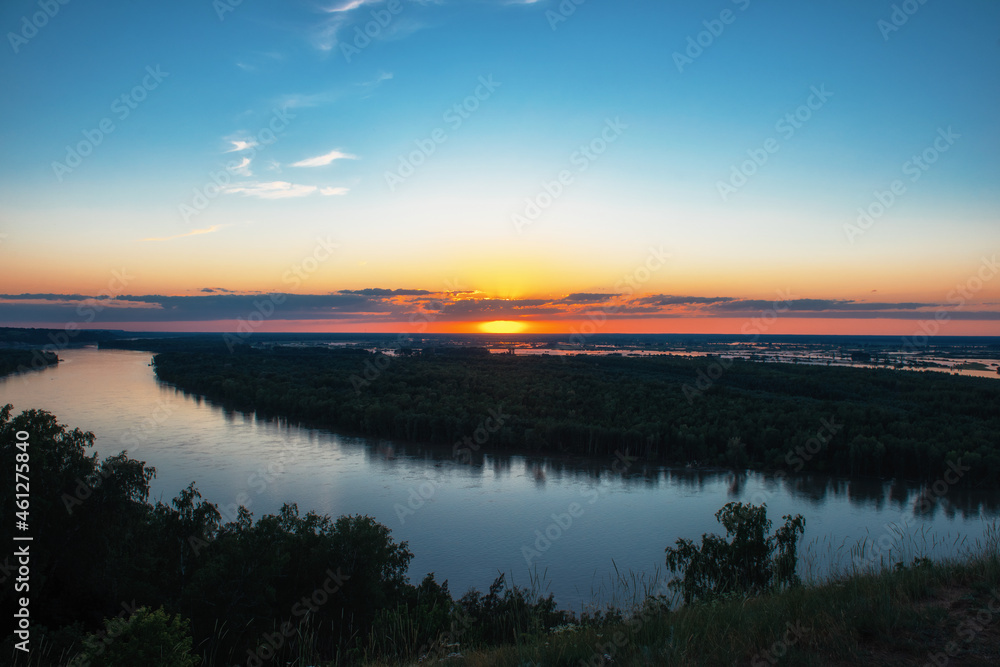 Aerial drone view of river landscape in sunny summer sunset. Top view of siberian Ob river from high attitude in summer sunset. Panorama, bird's eye view