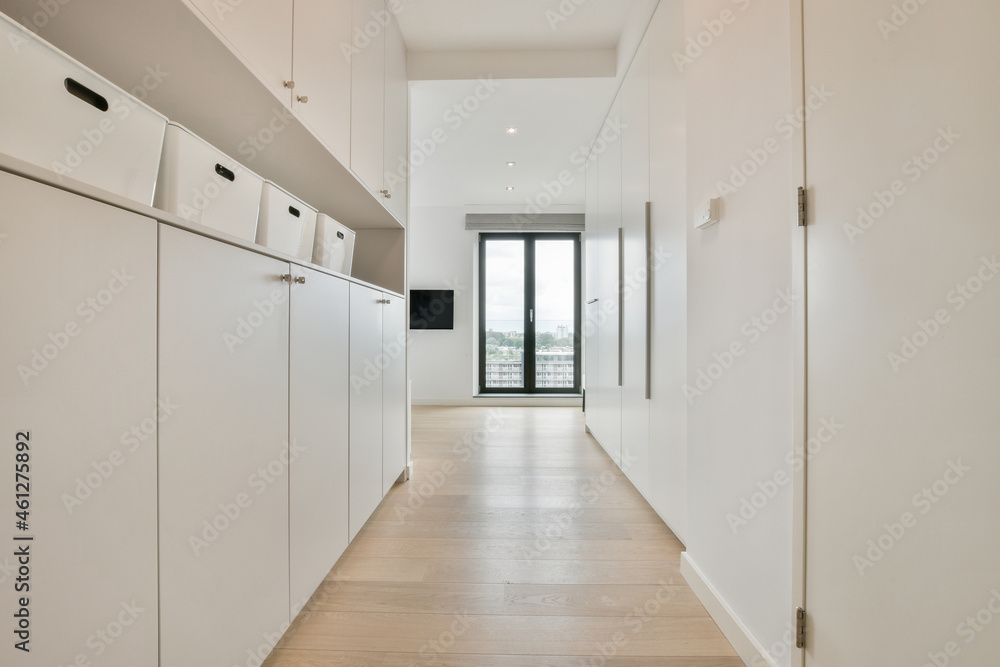 Corridor with white cabinets in apartment Corridor with white cabinets in apartment