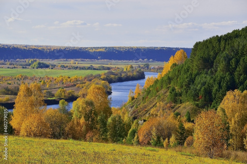 Mount Sorokinskaya with white gypsum rocks among the autumn foliage on the right bank of the Sylva River