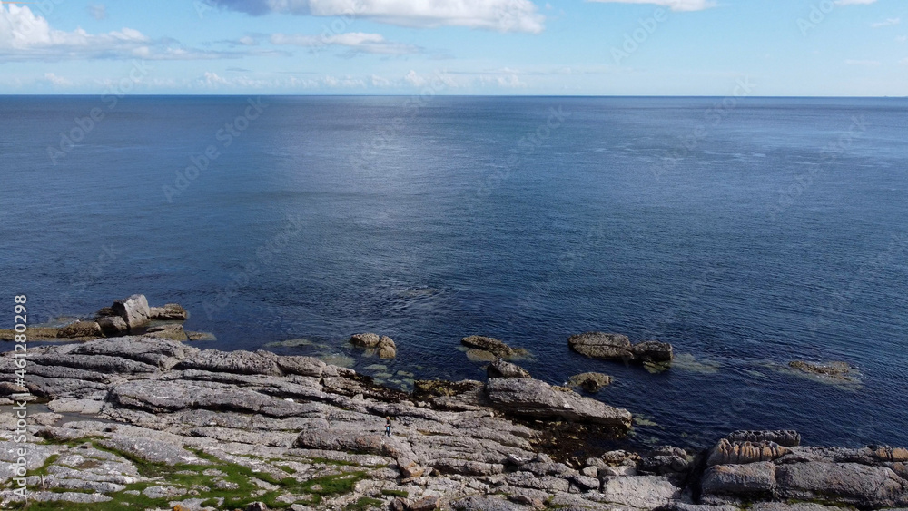 Aerial photo of Beautiful Scenery of Rocks Mountains and Sea at the North Coast of Ireland Aerial photo of Beautiful Scenery of Rocks Mountains and Sea at the North Coast of Ireland
