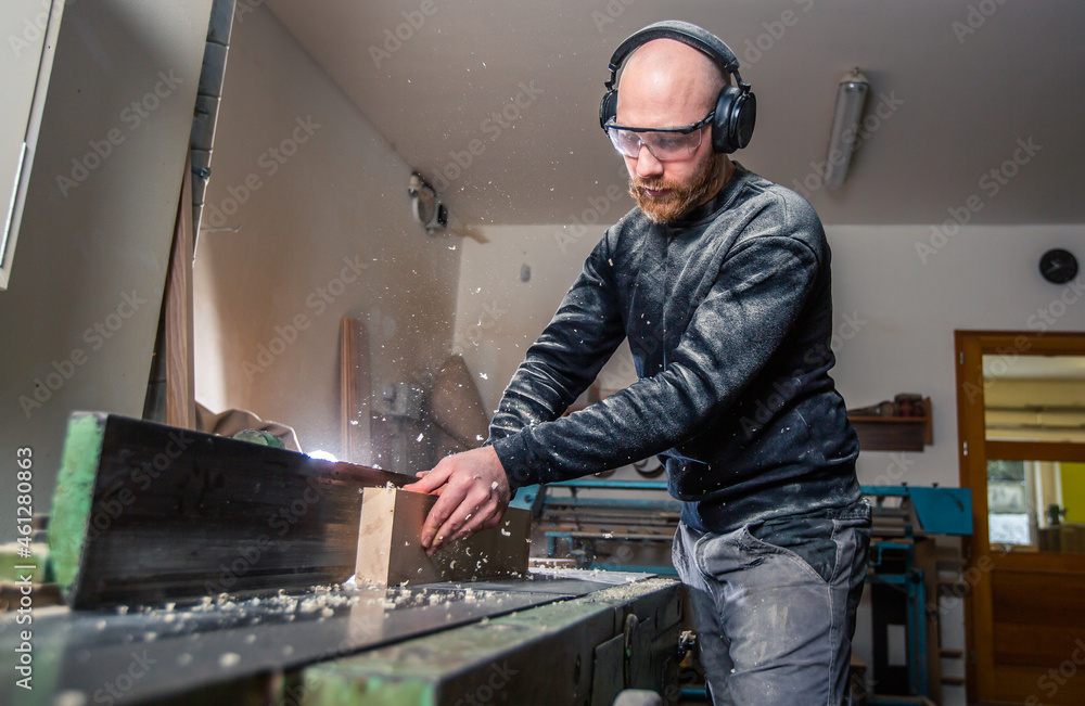 © Khaligo - Joinery, woodworking and furniture making, professional carpenter cutting wood in the carpentry shop, industrial concept © Khaligo - Joinery, woodworking and furniture making, professional carpenter cutting wood in the carpentry shop, industrial concept