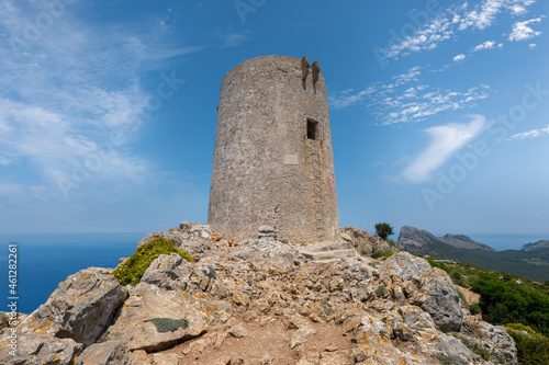 The remains of the centuries-old Albercutx watchtower on the Spanish Mediterranean island of Mallorca. In the background you can see the eastern part of the Formentor peninsula and the sea. photo