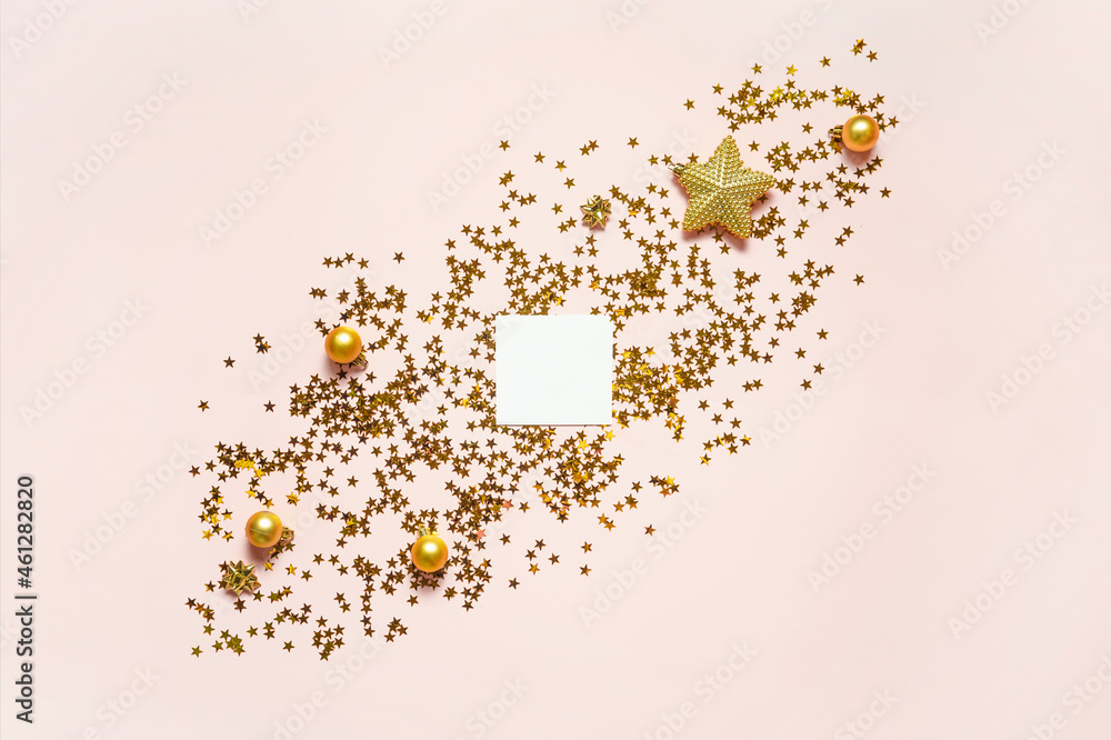 Christmas composition. Frame of golden sparkling stars on pink. Stardust border background. New Year holiday concept Christmas composition. Frame of golden sparkling stars on pink. Stardust border background. New Year holiday concept