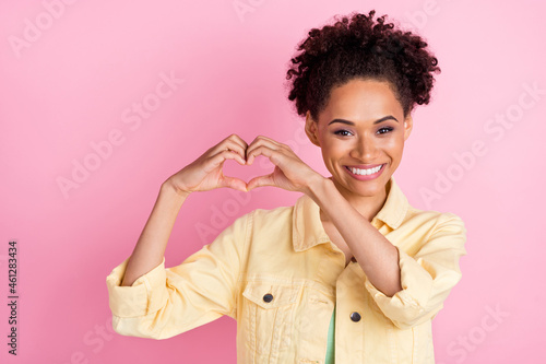 Photo of flirty millennial brunette lady show heart wear yellow shirt isolated on pink color background
