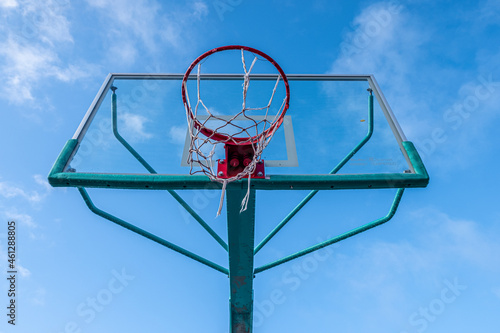 Basketball hoop and backboard viewed from the ground © VicVaz