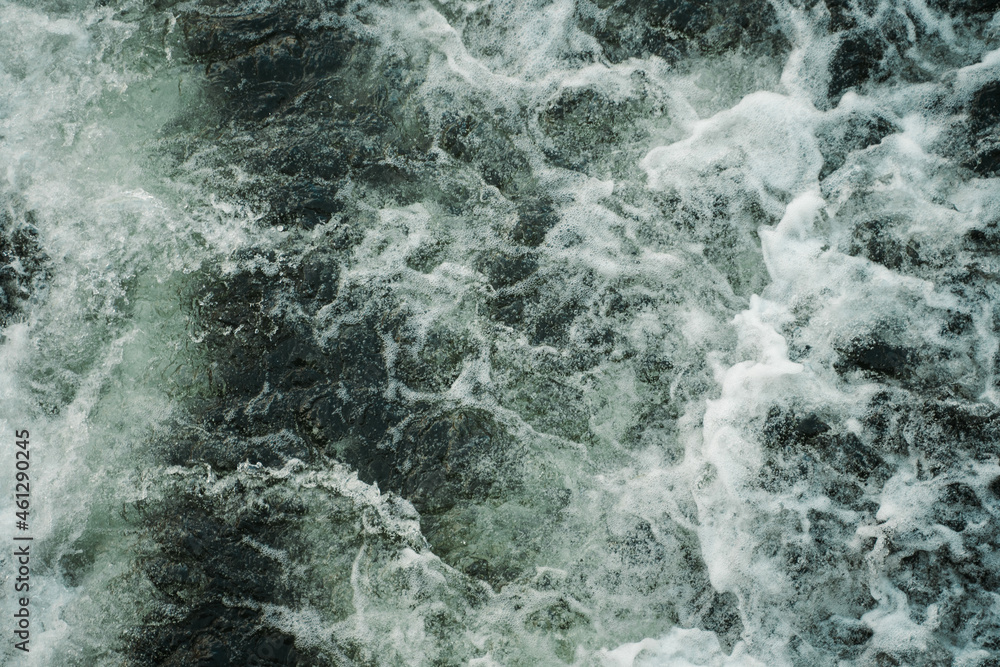 Dark water swirling waves and foam texture background