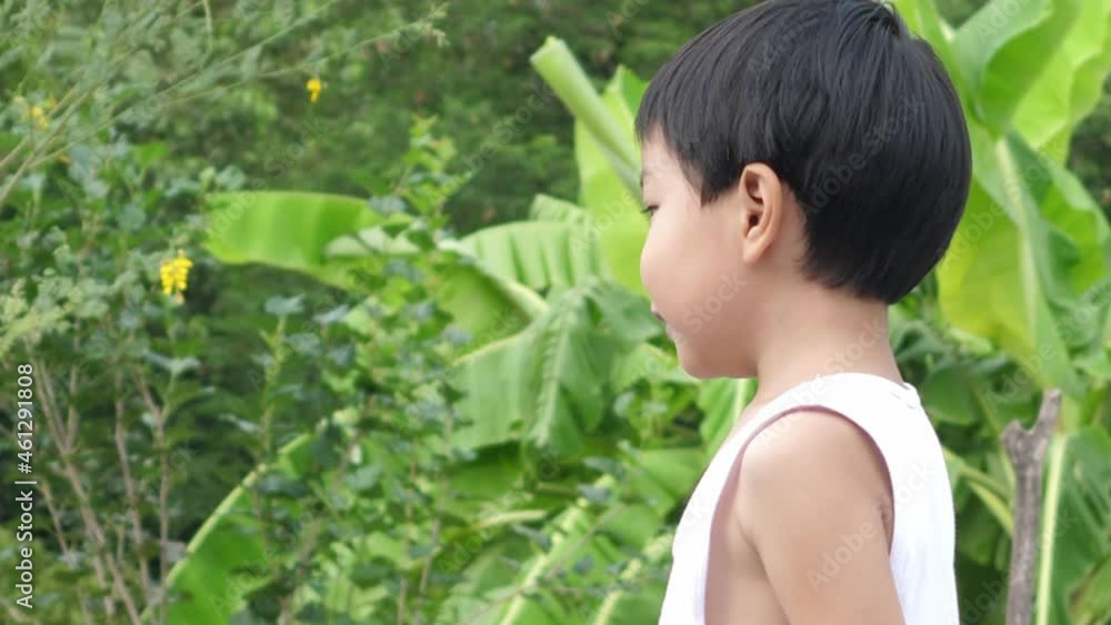 Active asian cute child boy playing plane toy to sky outdoor in green nature background with happy smiling face in summer. Concept of success, happy freedom, startup business, fun family activity, Active asian cute child boy playing plane toy to sky outdoor in green nature background with happy smiling face in summer. Concept of success, happy freedom, startup business, fun family activity,