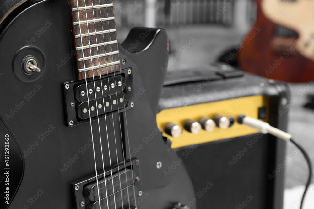 Electric guitar with amplifier at recording studio, closeup. Music band practice Electric guitar with amplifier at recording studio, closeup. Music band practice