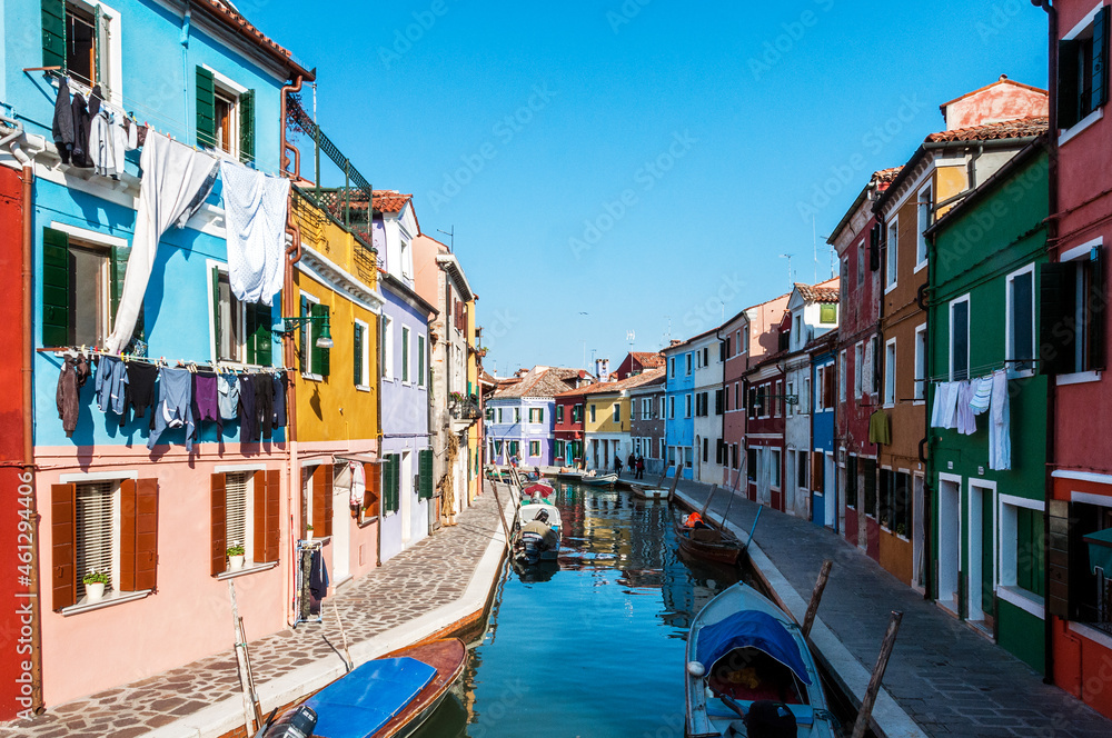 Italy. Veneto, Burano. Coloured houses along canal in Burano village